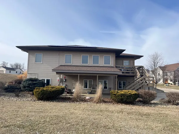 a car parked in front of white house
