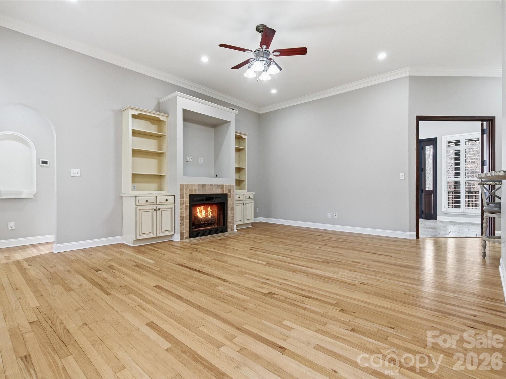 117 Abernathy Road Stanley, NC 28164 - Photo 17 of 47 a view of empty room with wooden floor and fireplace