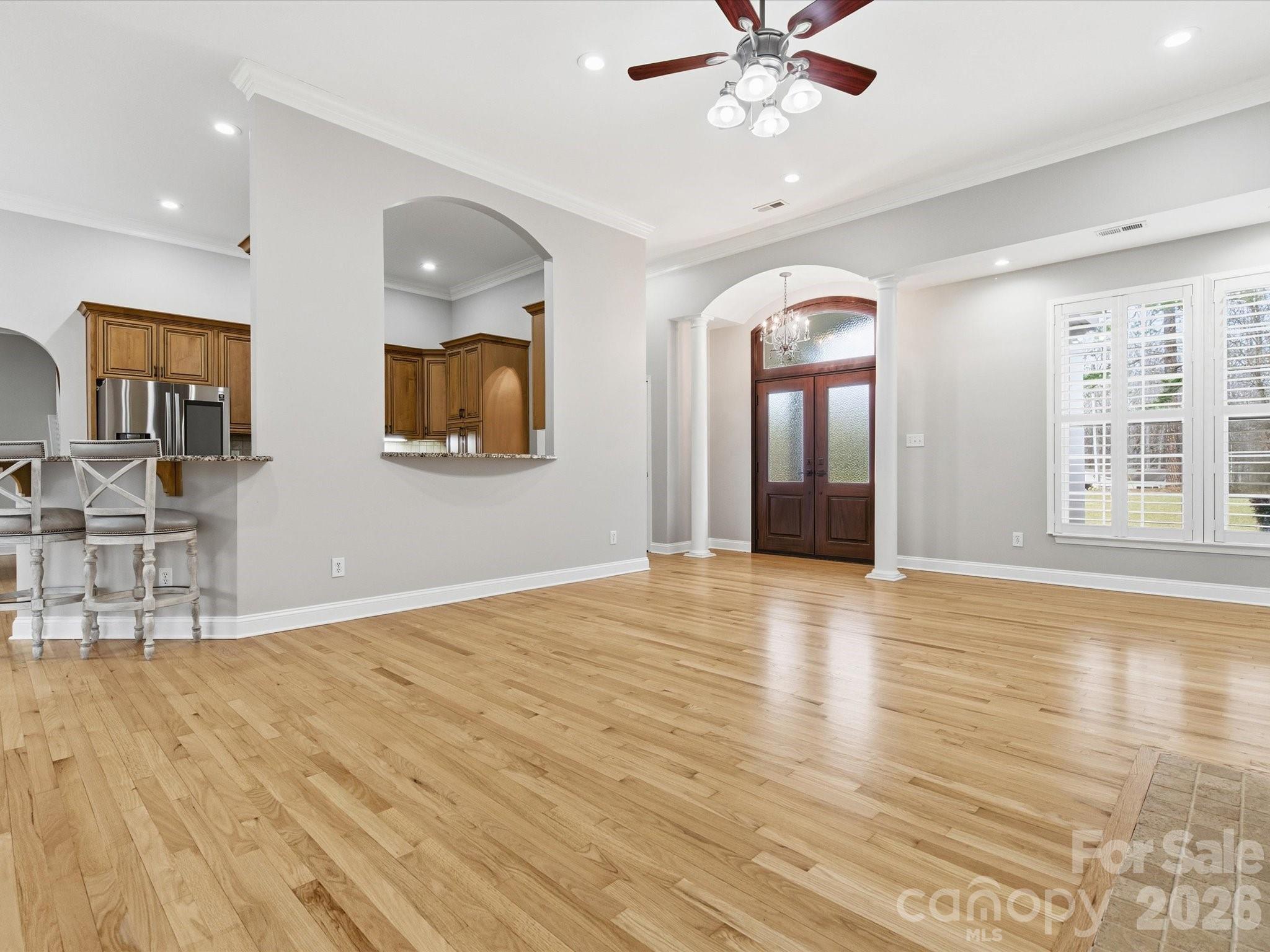 117 Abernathy Road Stanley, NC 28164 - Photo 19 of 47 a view of an empty room with window and wooden floor