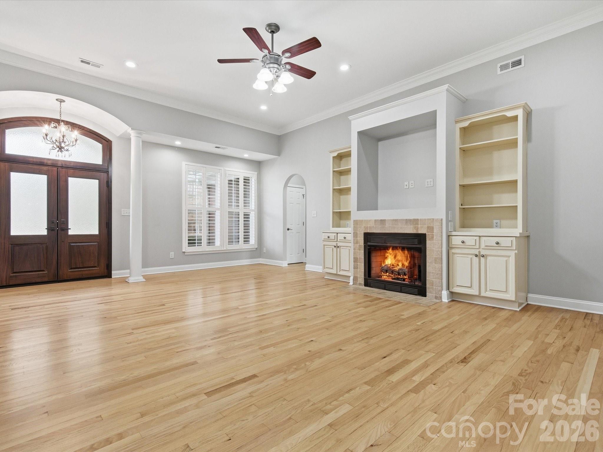 117 Abernathy Road Stanley, NC 28164 - Photo 20 of 47 a view of an empty room with a fireplace and a window