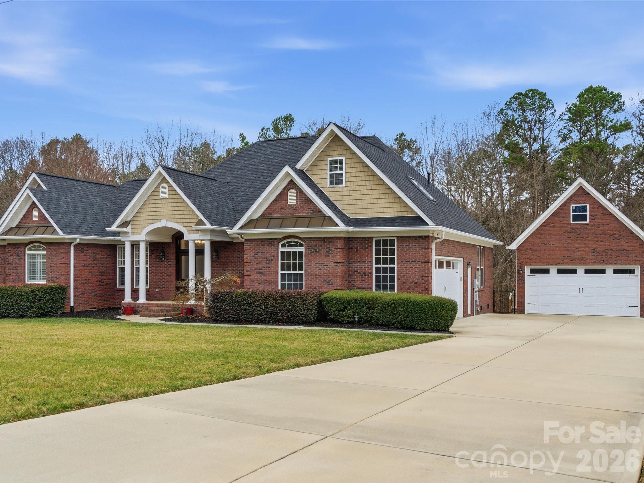 117 Abernathy Road Stanley, NC 28164 - Photo 2 of 47 a front view of a house with a yard and garage