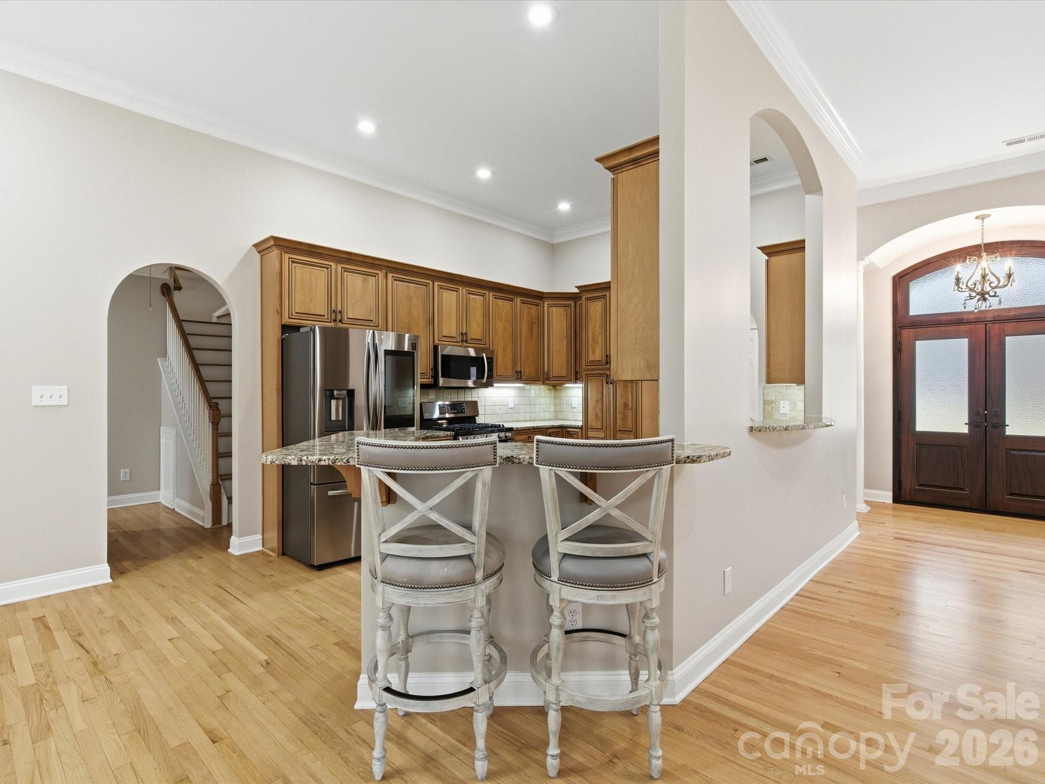 117 Abernathy Road Stanley, NC 28164 - Photo 21 of 47 a kitchen with stainless steel appliances kitchen island granite countertop a refrigerator and cabinets