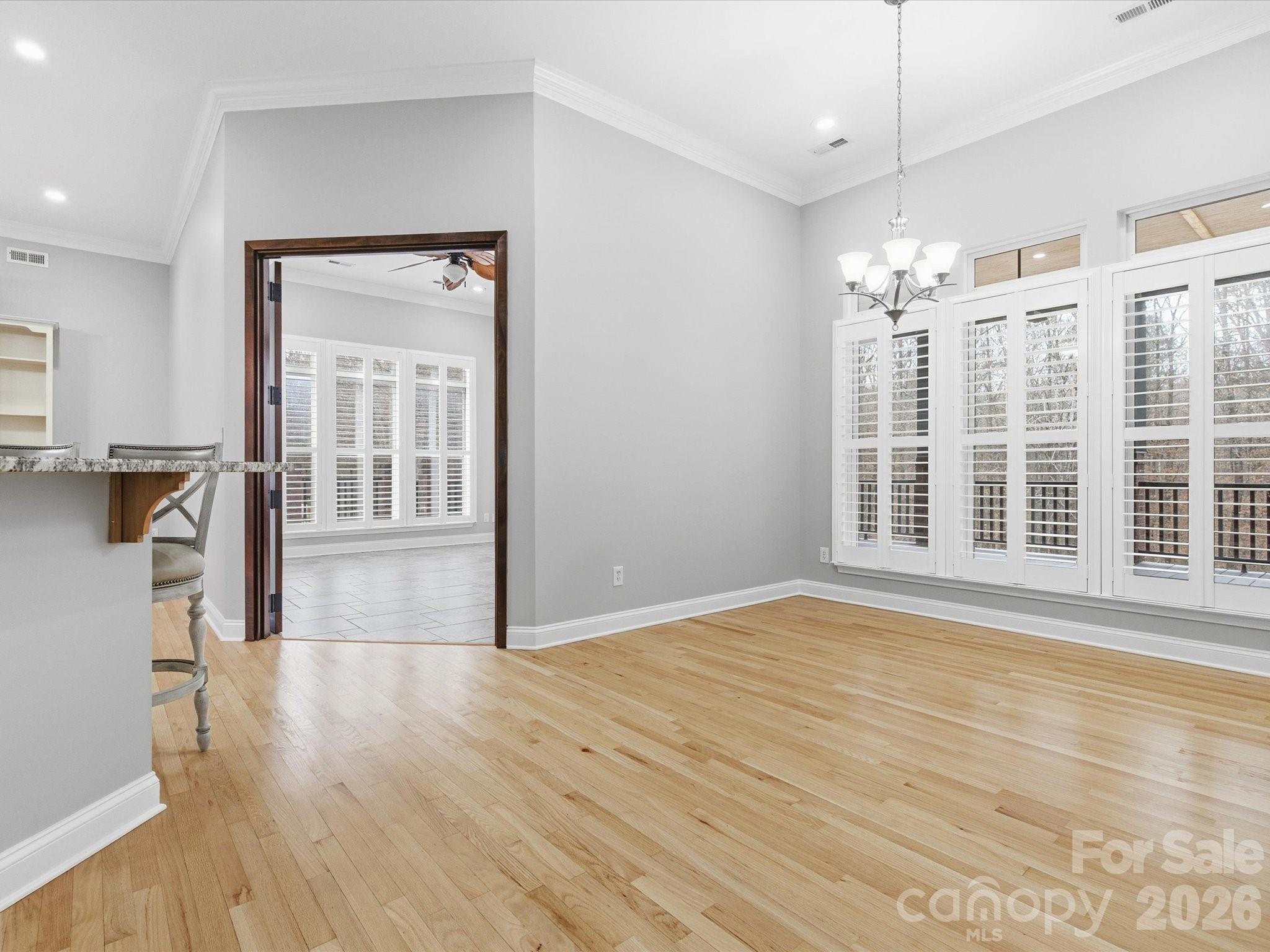 117 Abernathy Road Stanley, NC 28164 - Photo 29 of 47 a view of empty room with wooden floor and fan