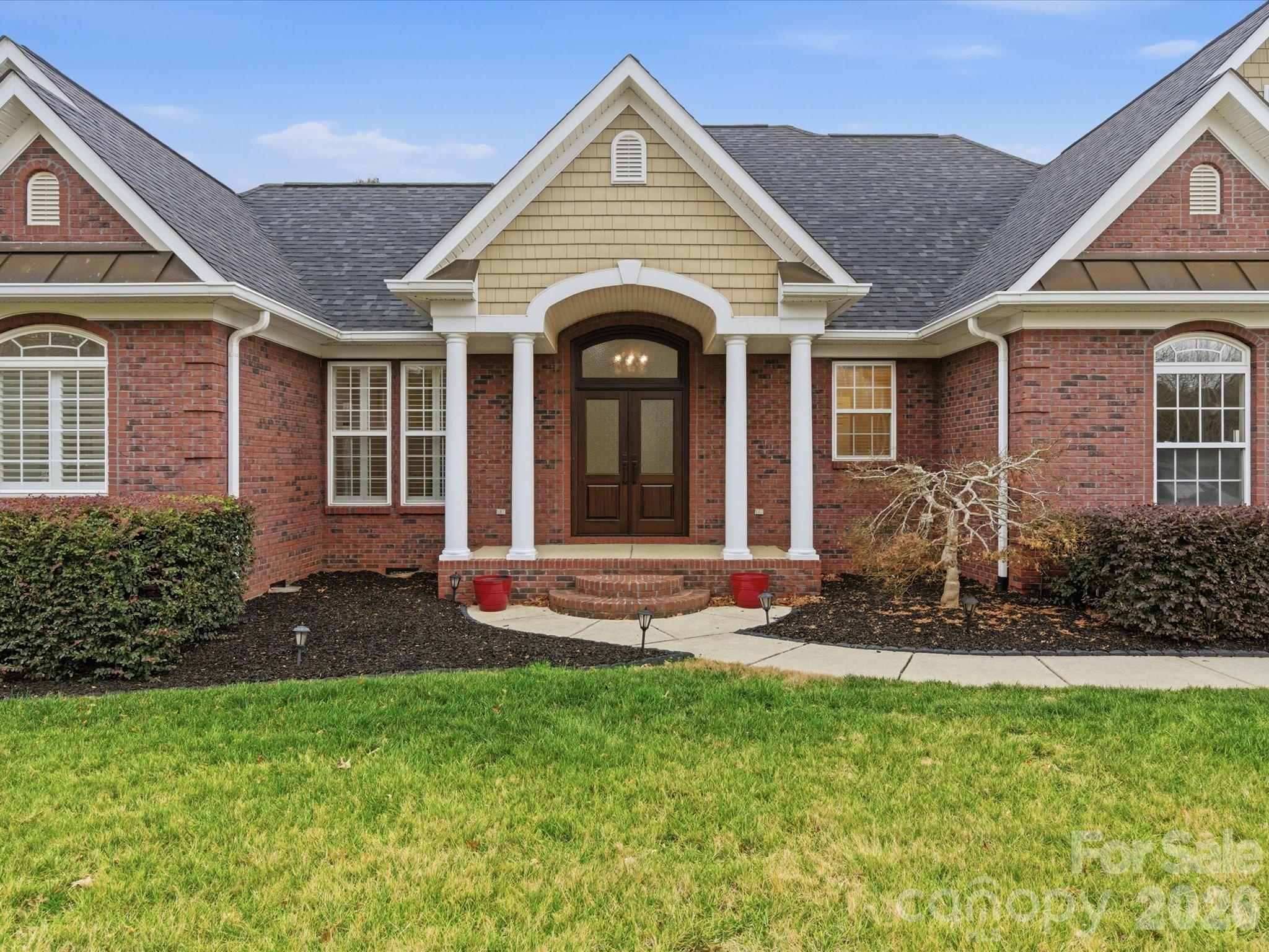117 Abernathy Road Stanley, NC 28164 - Photo 3 of 47 a front view of a house with a yard