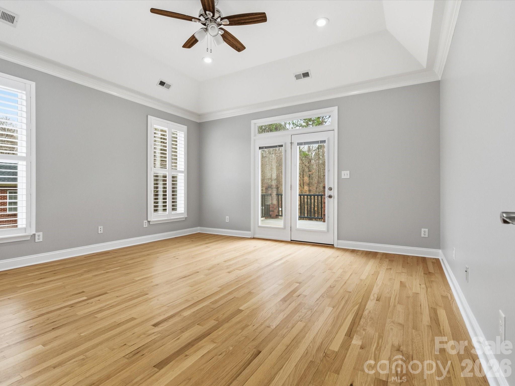 117 Abernathy Road Stanley, NC 28164 - Photo 34 of 47 a view of an empty room with wooden floor and a window