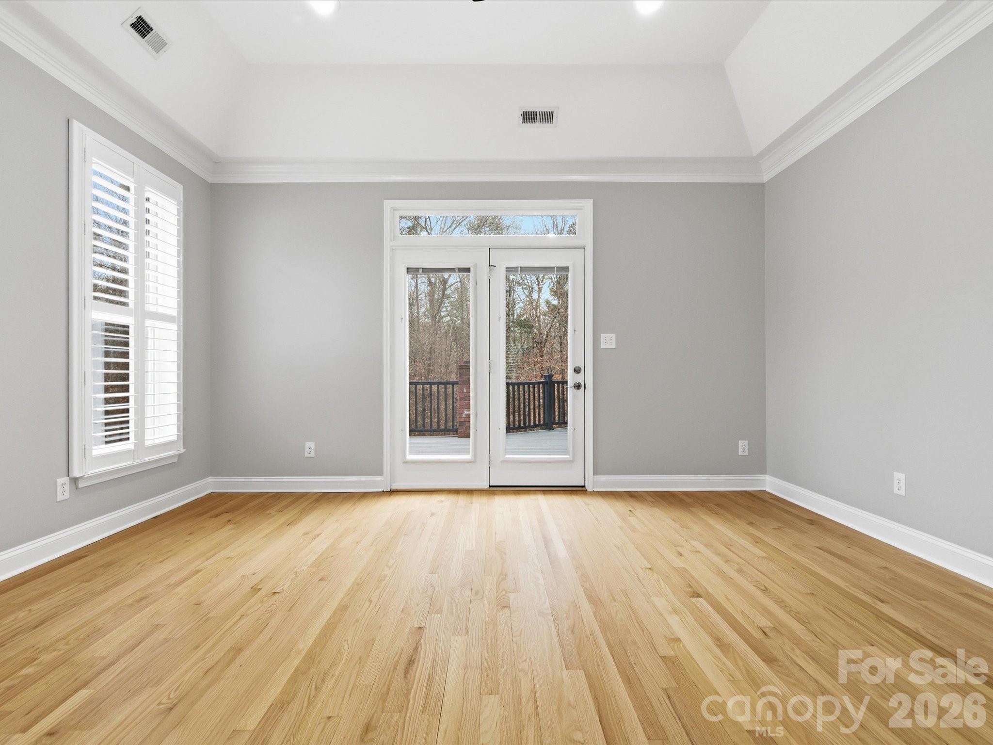 117 Abernathy Road Stanley, NC 28164 - Photo 36 of 47 a view of an empty room with wooden floor and a window