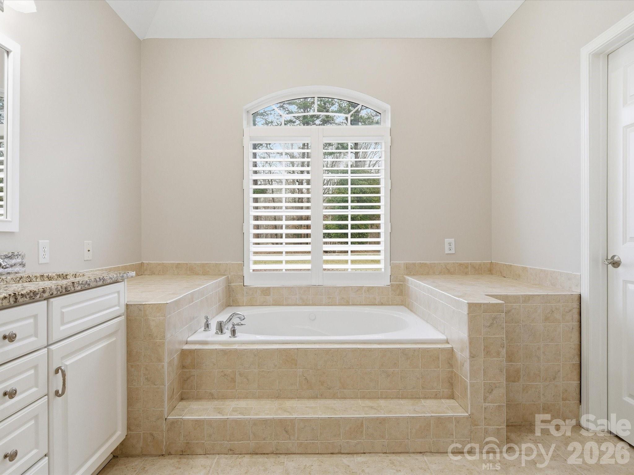 117 Abernathy Road Stanley, NC 28164 - Photo 38 of 47 a bathroom with bathtub next to a window