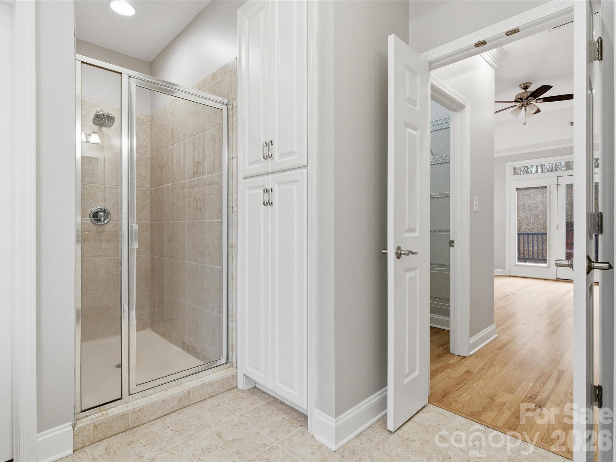 117 Abernathy Road Stanley, NC 28164 - Photo 40 of 47 a bathroom with a glass shower door and a glass door