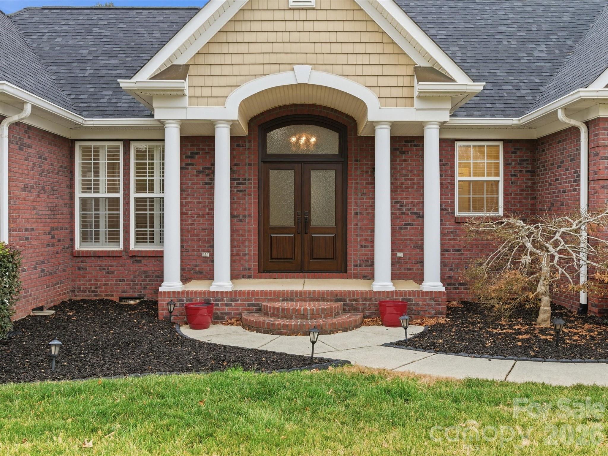 117 Abernathy Road Stanley, NC 28164 - Photo 4 of 47 a front view of a house with garden
