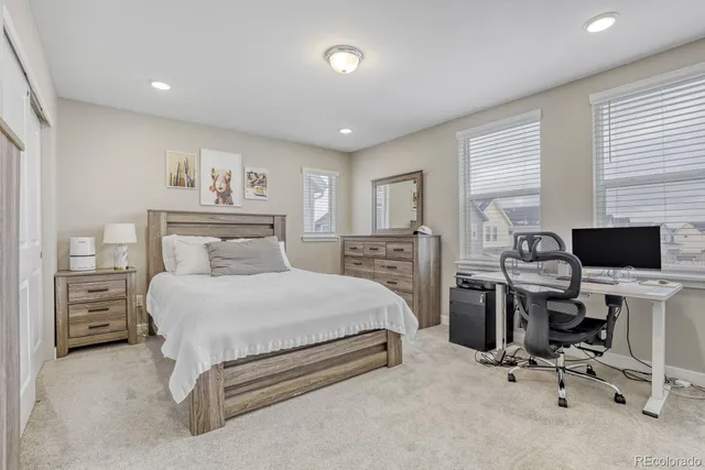 a bedroom with a bed and furniture
