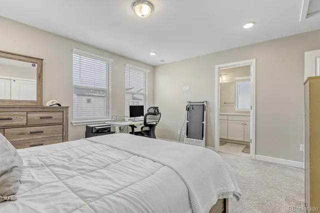 a bedroom with a large bed and furniture