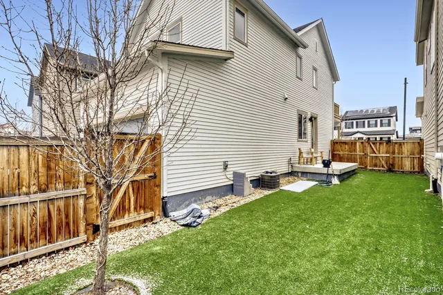 a view of backyard with sitting area