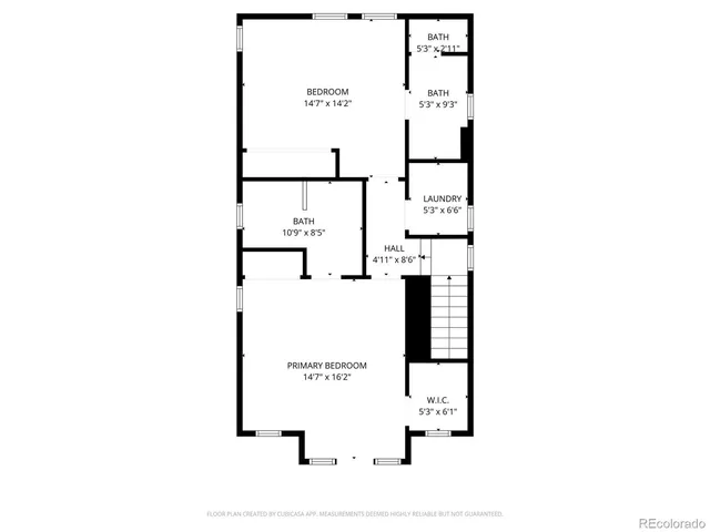 a picture of a bench in front of a wall