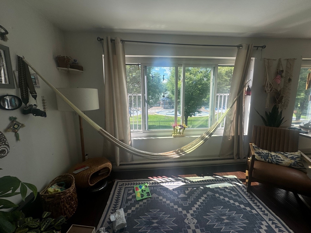 128 Marginal Street, Unit 2 Boston, MA 02128 - Photo 3 of 10 a view of a porch with wooden floor and a yard