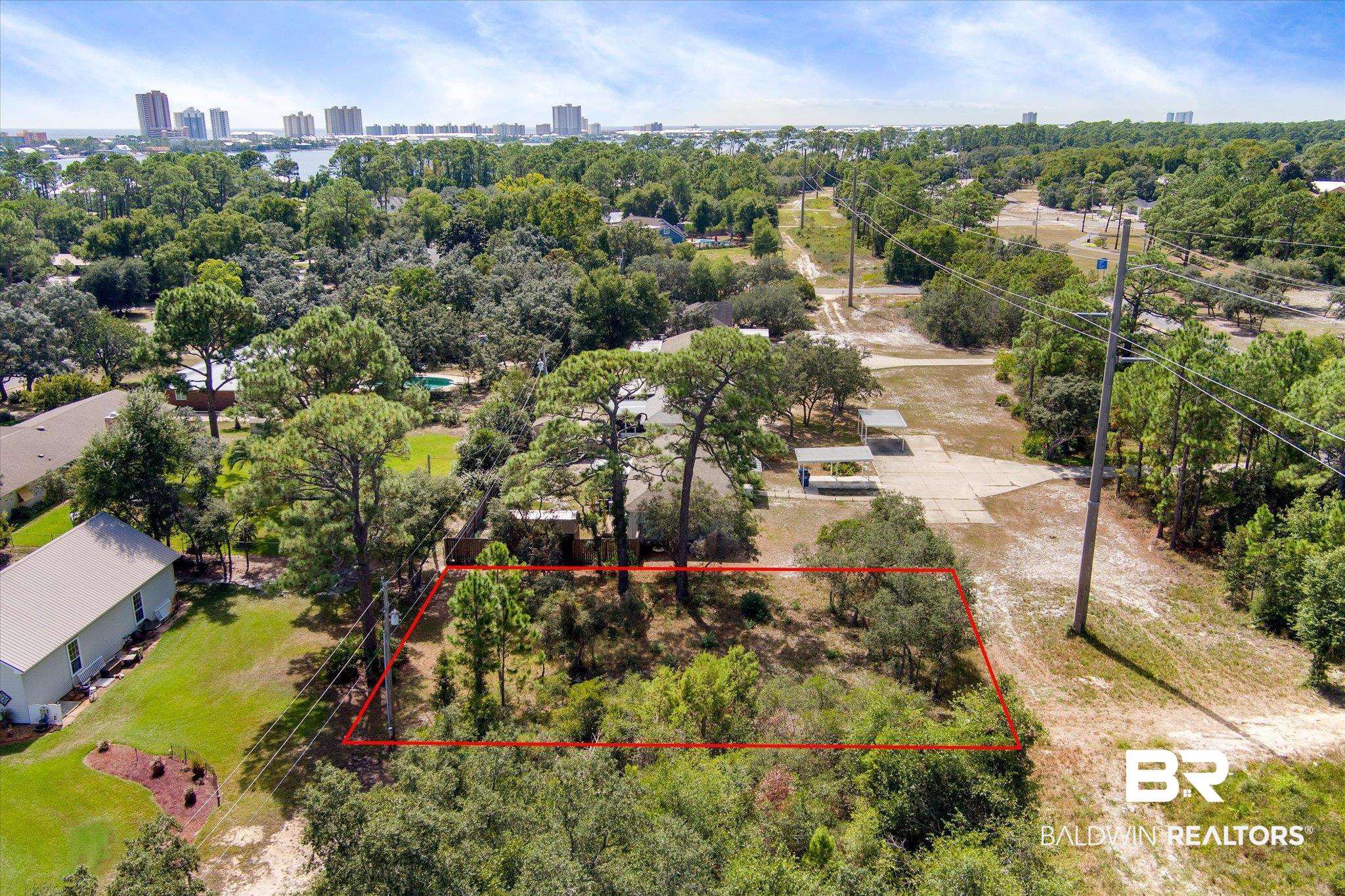 417 West Fort Morgan Road Gulf Shores, AL 36542 - Photo 1 of 16 Cleared driveway to lot