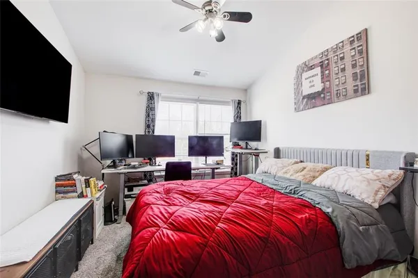 a bed room with a bed and a couch