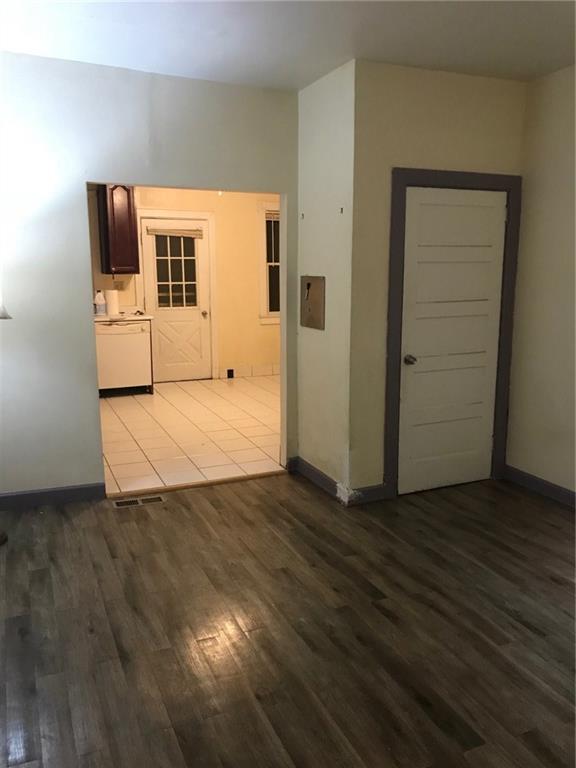 Newer flooring for the living room with a coat closet.  
