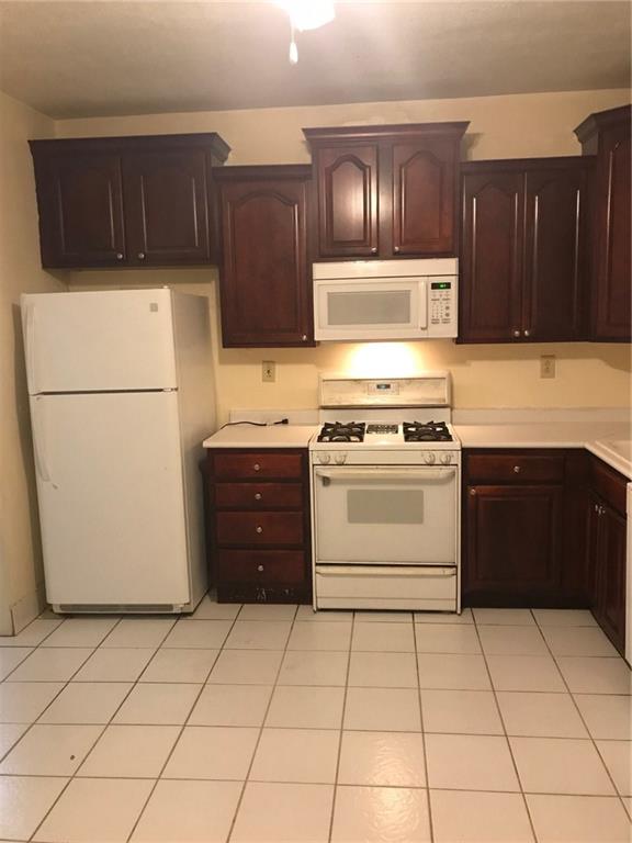 Beautiful tile floors and the newer cabinetry in this large eat-in kitchen!