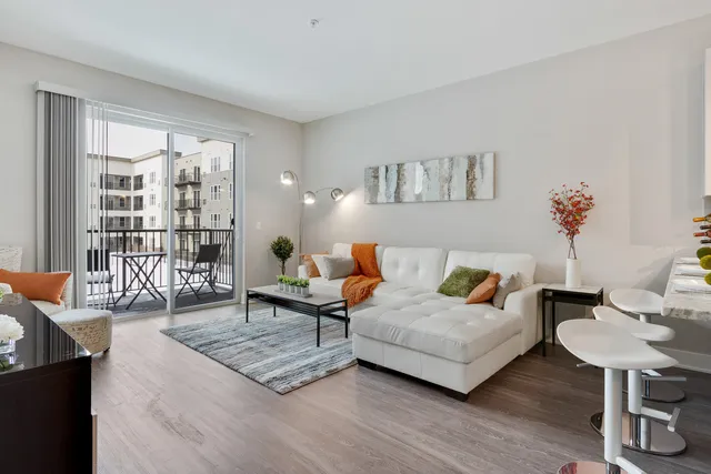 a living room with furniture and a table