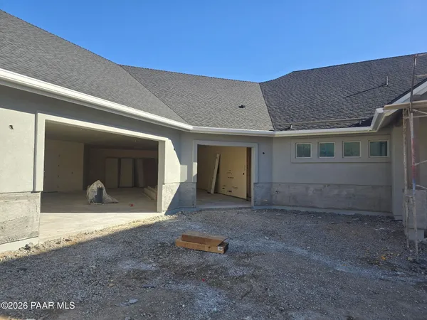 a view of a house with backyard porch and glass door