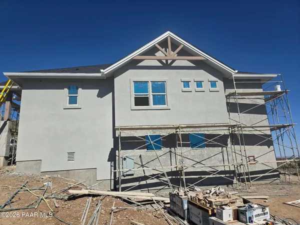 a room with gym equipment and large window