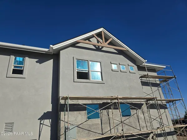 a front view of a house with parking space