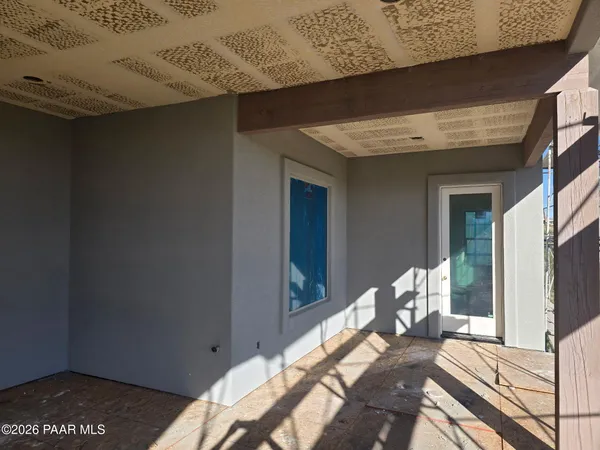 a view of a living room and wooden floor