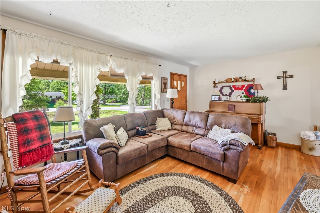 6127 Columbus Road Northeast Louisville, OH 44641 - Photo 6 of 49 Living room with hardwood floors