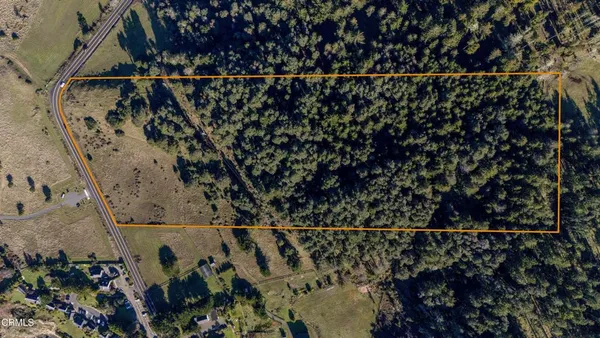 a view of lake with green space