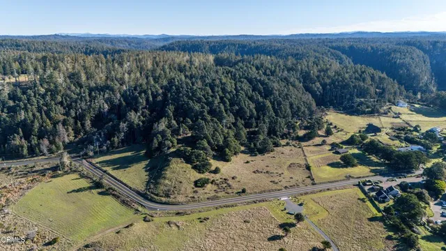 a view of a town with mountains in the background
