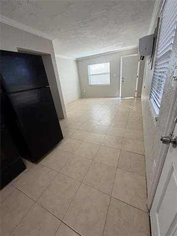 a view of an empty room with a fireplace