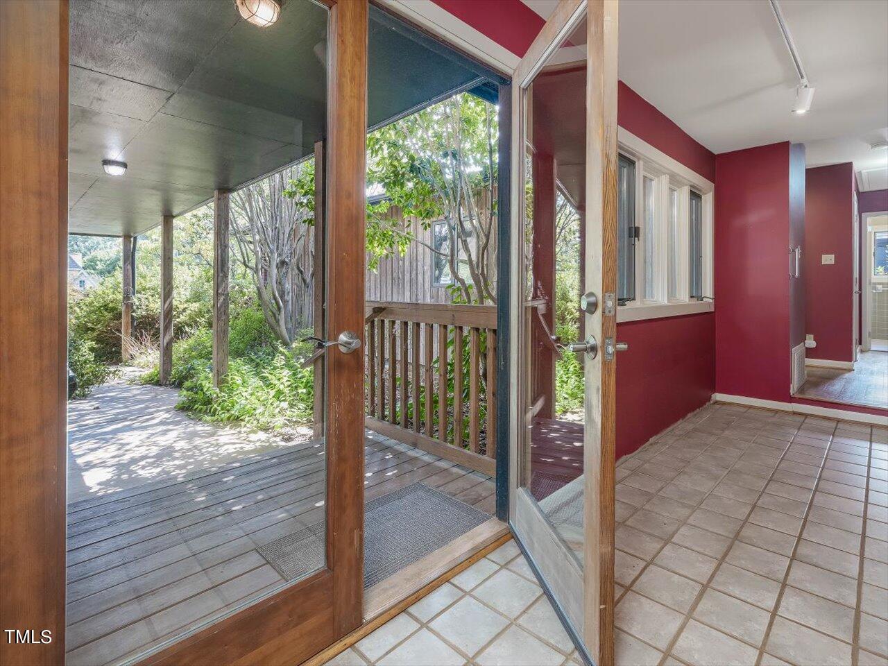 2129 Ridge Road Raleigh, NC 27607 - Photo 12 of 79 a view of a porch with wooden floor and outdoor space