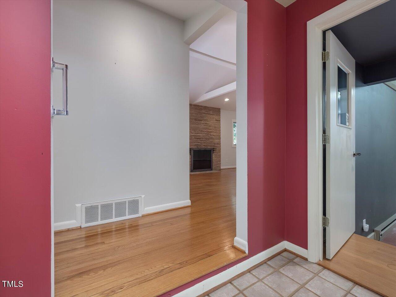 2129 Ridge Road Raleigh, NC 27607 - Photo 14 of 79 a view of a hallway with wooden floor and entryway