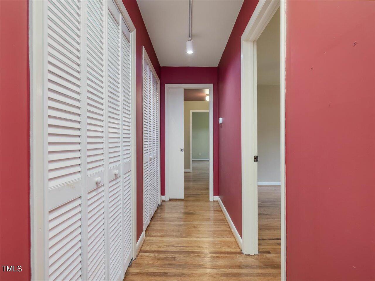 2129 Ridge Road Raleigh, NC 27607 - Photo 15 of 79 a view of a hallway with wooden floor and staircase