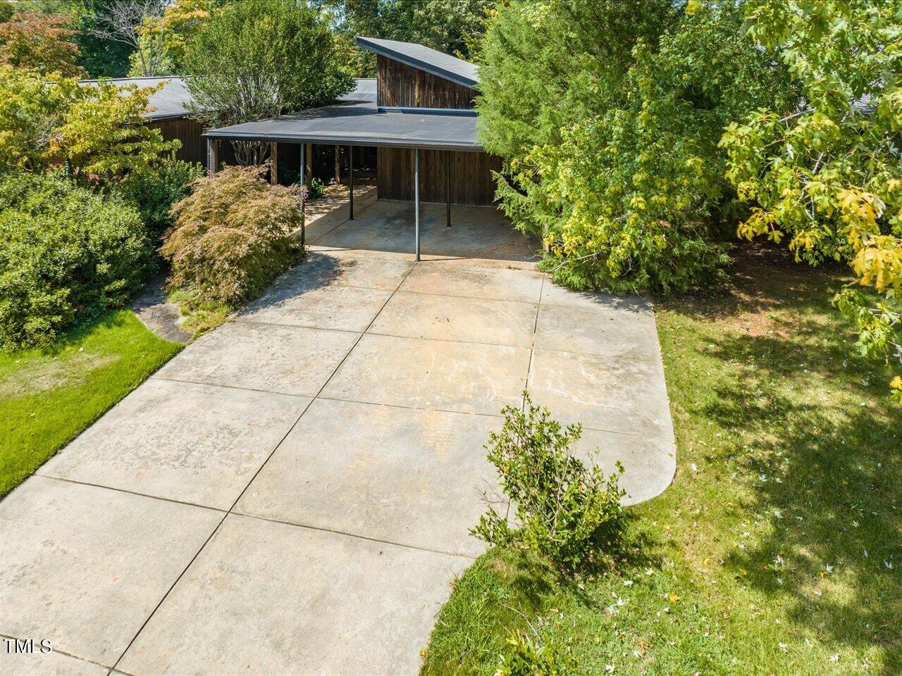 2129 Ridge Road Raleigh, NC 27607 - Photo 2 of 79 a front view of a house with a yard