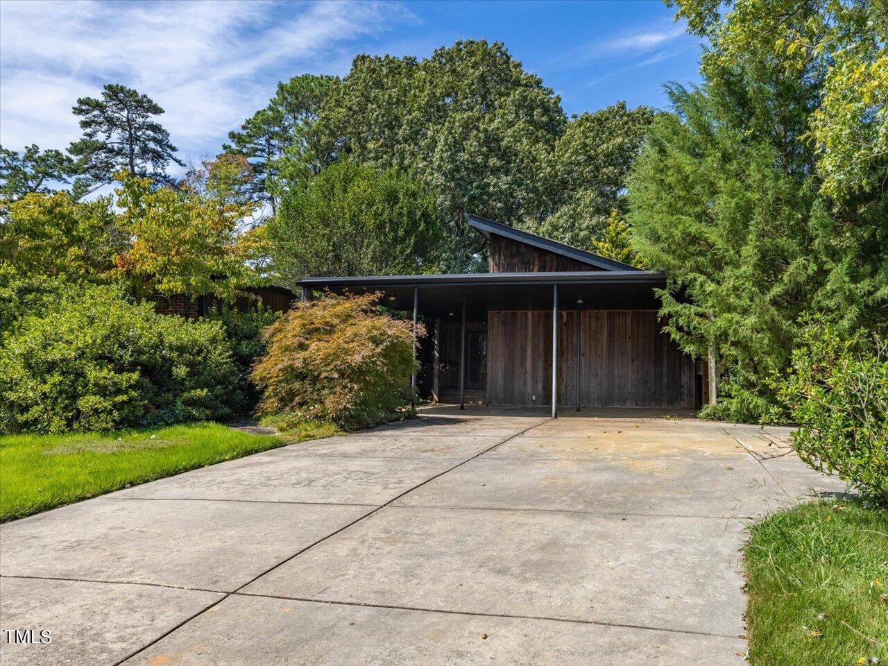 2129 Ridge Road Raleigh, NC 27607 - Photo 4 of 79 a front view of a house with a yard and garage