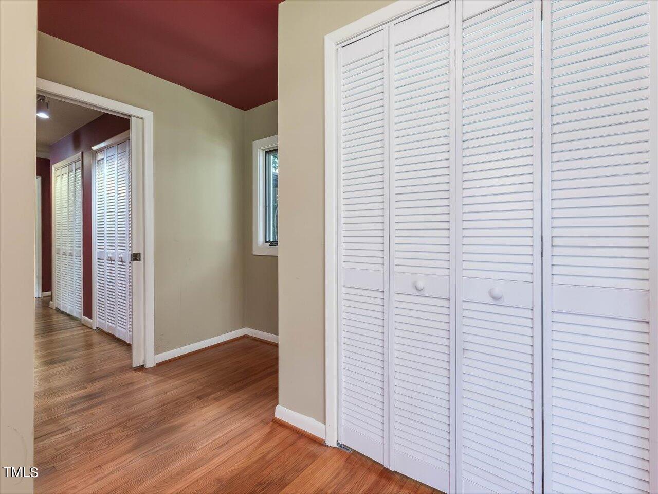 2129 Ridge Road Raleigh, NC 27607 - Photo 43 of 79 a view of a hallway with wooden floor and staircase
