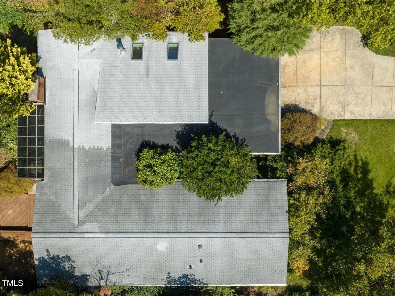 2129 Ridge Road Raleigh, NC 27607 - Photo 73 of 79 an aerial view of a house with a yard and large trees