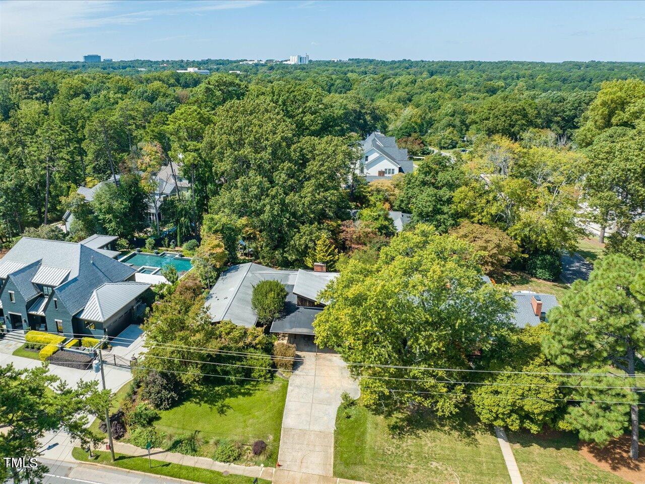 2129 Ridge Road Raleigh, NC 27607 - Photo 76 of 79 an aerial view of residential house with outdoor space and trees all around