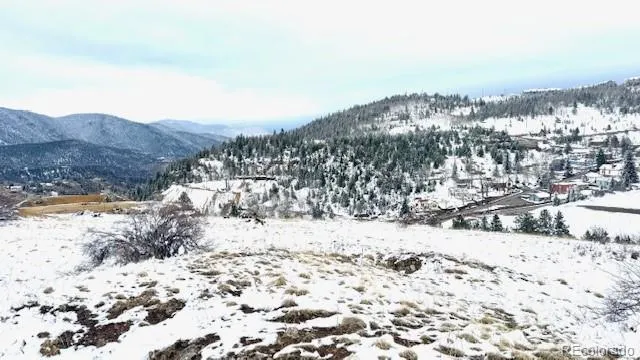 a view of a covered with snow on the road