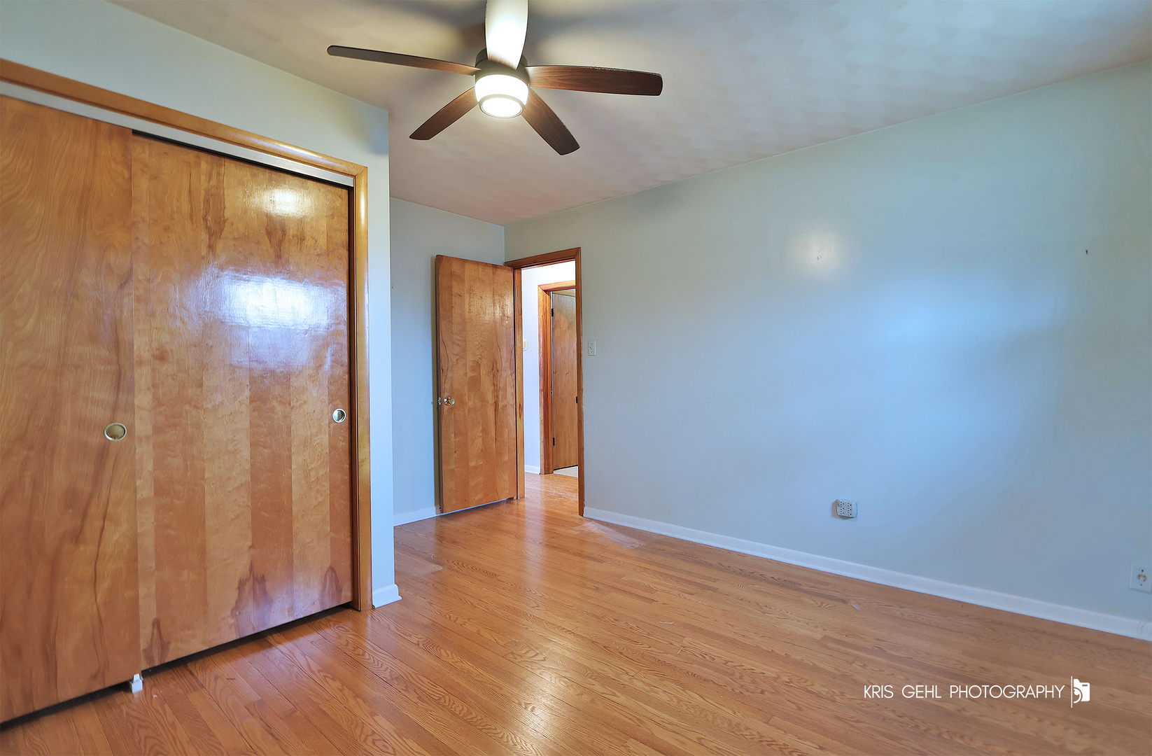 40798 North Forest View Road Wadsworth, IL 60083 - Photo 11 of 29 an empty room with wooden floor a ceiling fan and closet area