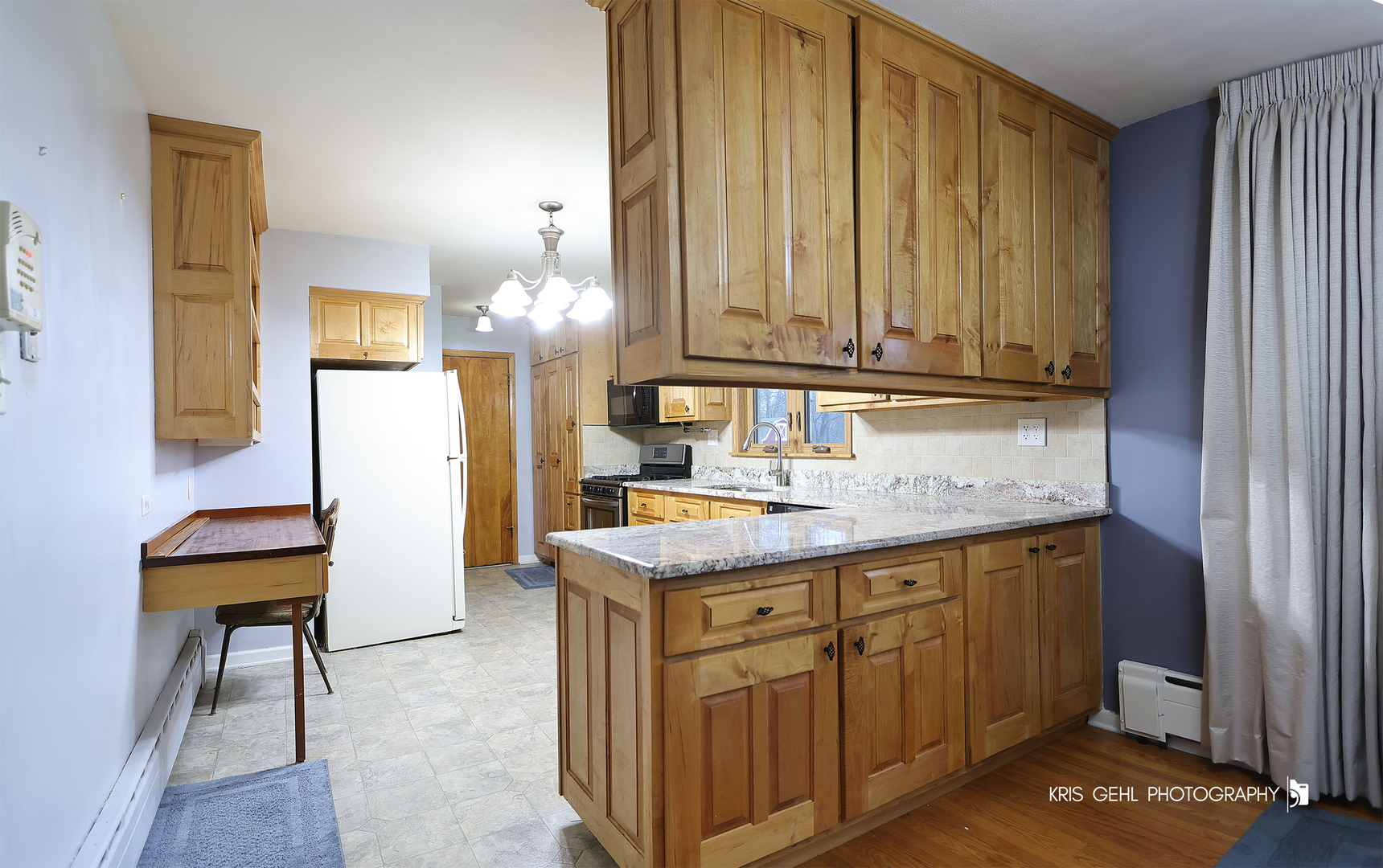 40798 North Forest View Road Wadsworth, IL 60083 - Photo 6 of 29 a kitchen with a sink and cabinets