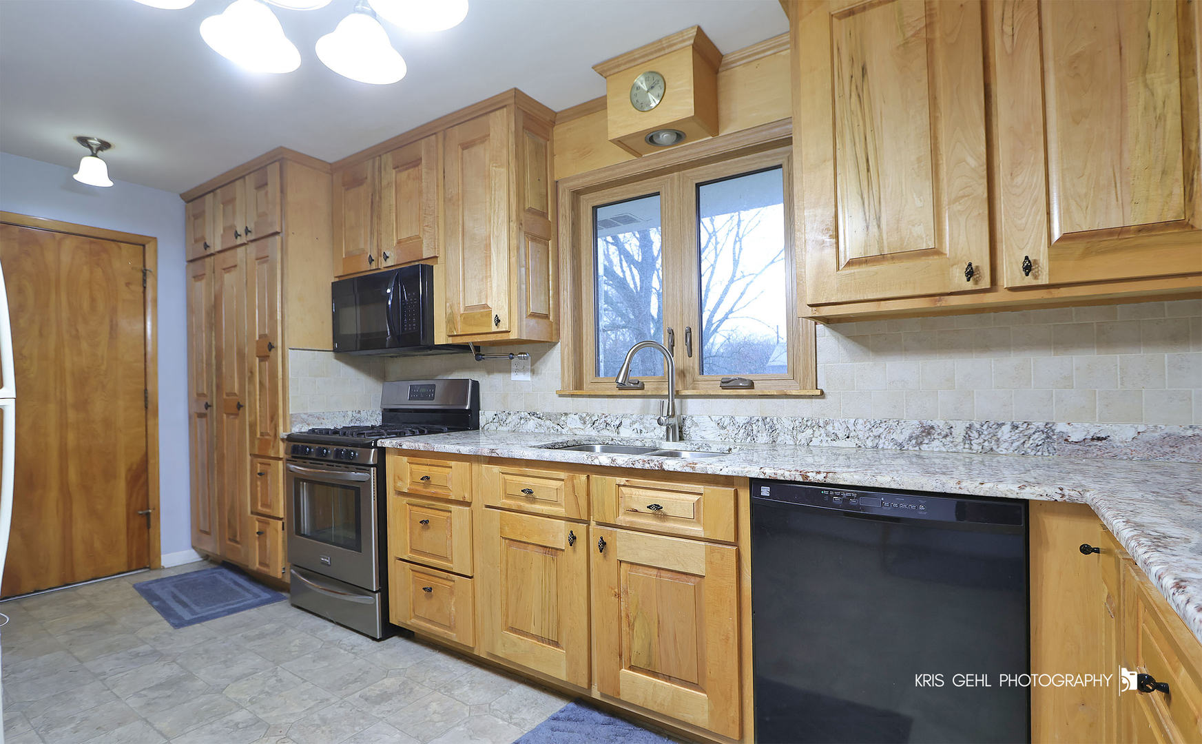 40798 North Forest View Road Wadsworth, IL 60083 - Photo 7 of 29 a kitchen with stainless steel appliances granite countertop a sink stove and refrigerator