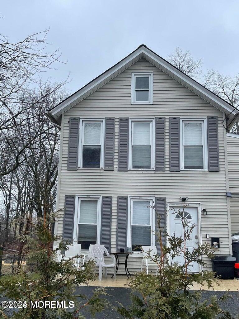 a front view of a house with yard