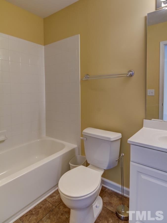 5309 Echo Ridge Road Raleigh, NC 27612 - Photo 22 of 23 a white toilet sitting next to a bath tub