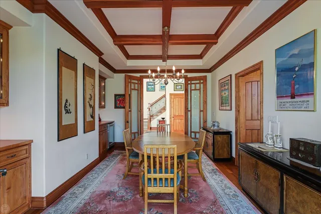 a living room with furniture and large windows