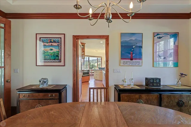 a living room with furniture and large windows