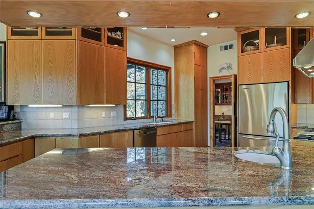 a view of a hallway and a livingroom with furniture