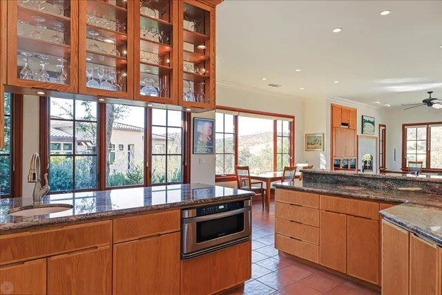 a living room with furniture potted plant and a fireplace
