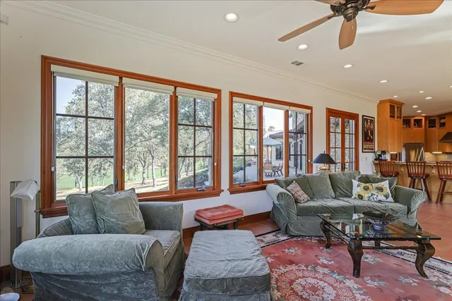 a bedroom with a bed couch and a window